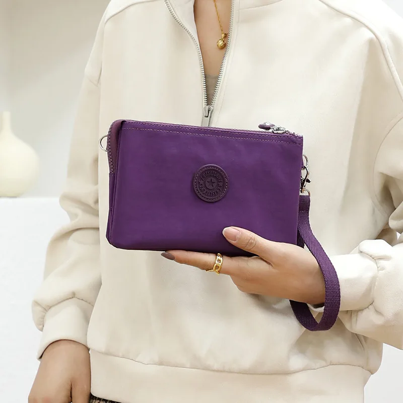 Didmeninė 2023 naujas moterų sankabos krepšys atsitiktinis nailono audinio monetos rankinėje multi-layer nešiojamas mobiliojo telefono krepšys